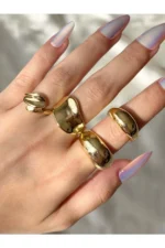 Women's Gold-Tone 4-Piece Designer Ring Set - Stylish and Modern Combination